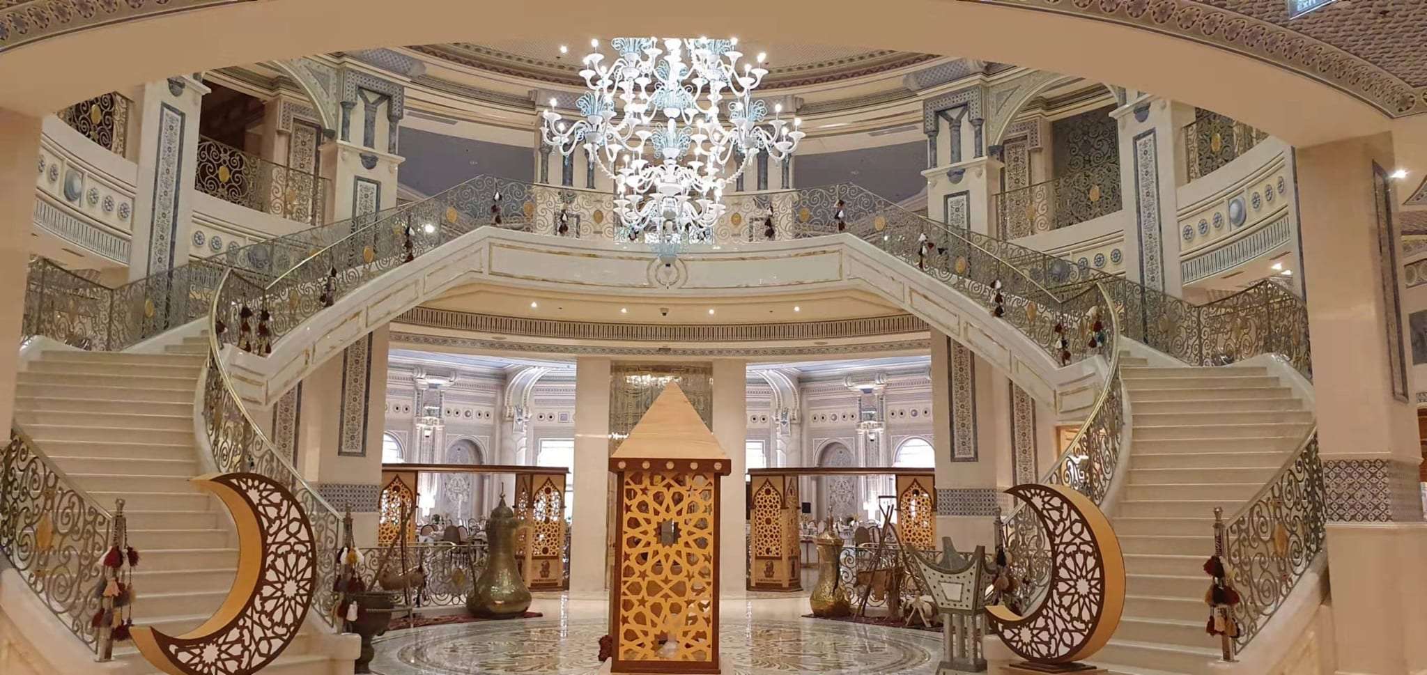 Chandelier and ornamented ceiling in the grand hall of The Ritz-Carlton, Riyadh
