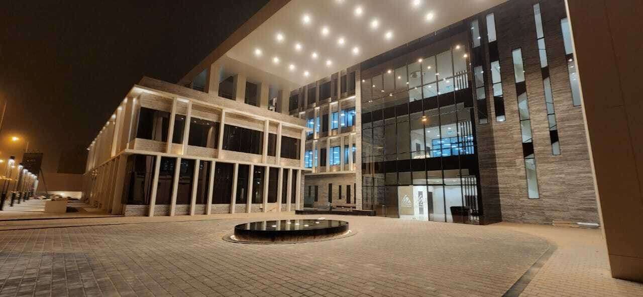 The lit plaza and external approach at the SEDER headquarters in Riyadh, an outdoor lighting scheme by ARAK