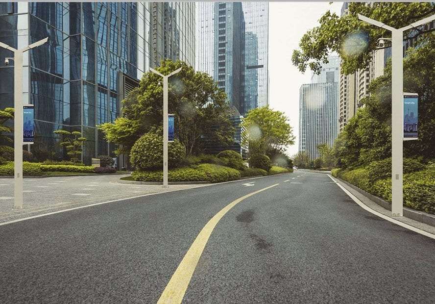 Smart poles along a landscaped city boulevard